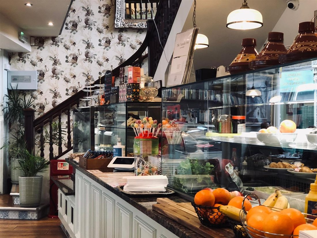 Inside The Vanilla Pod, with the counter and cake display
